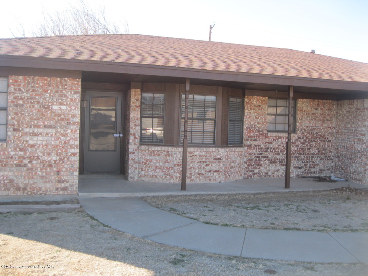 5714 South Milam Street Amarillo, TX 79110 - Photo 1 of 22 a front view of a house with garden
