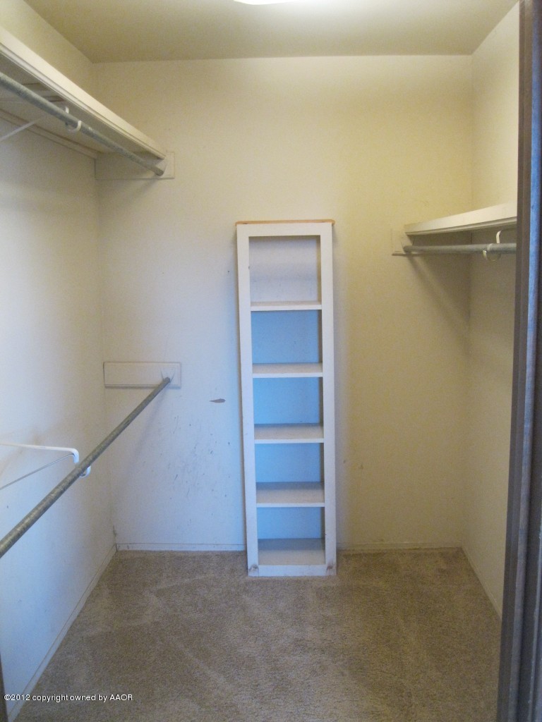 5714 South Milam Street Amarillo, TX 79110 - Photo 17 of 22 a view of an empty walk in closet