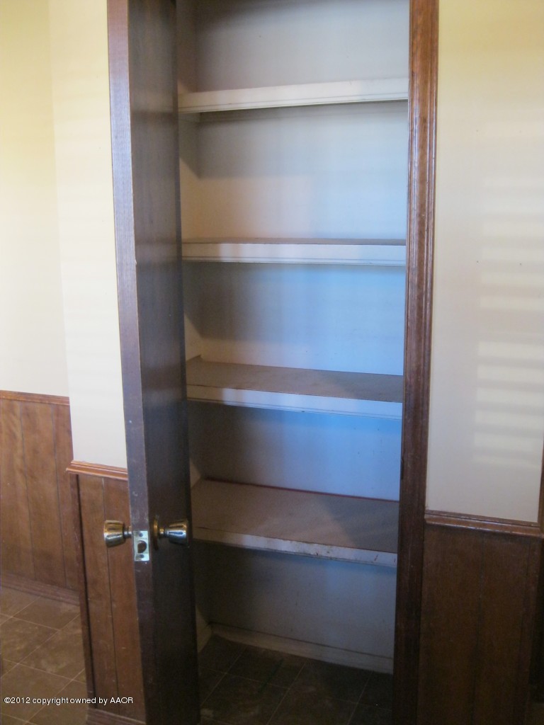 5714 South Milam Street Amarillo, TX 79110 - Photo 8 of 22 a view of walk in closet with empty racks