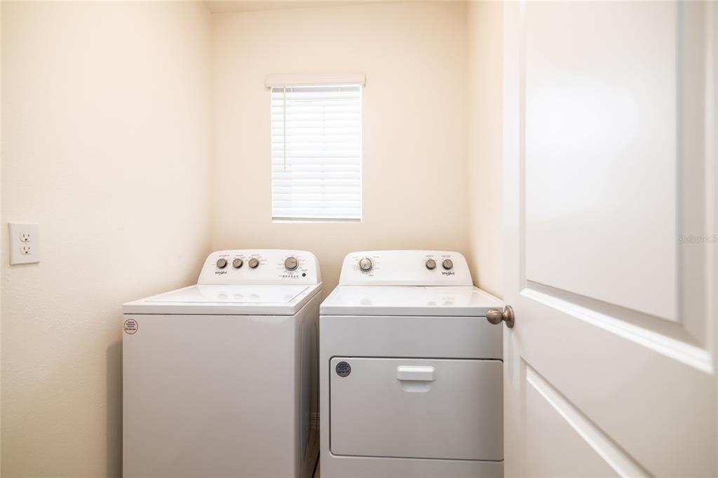 33860 Jasmine Star Loop Wesley Chapel, FL 33543 - Photo 13 of 14 a utility room with dryer and washer