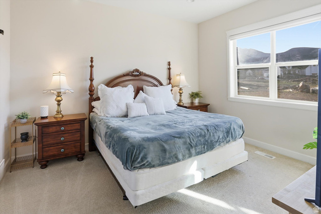 534 East Fish Hatchery Road Mantua, UT 84324 - Photo 34 of 87 Bedroom featuring light colored carpet and a mountain view