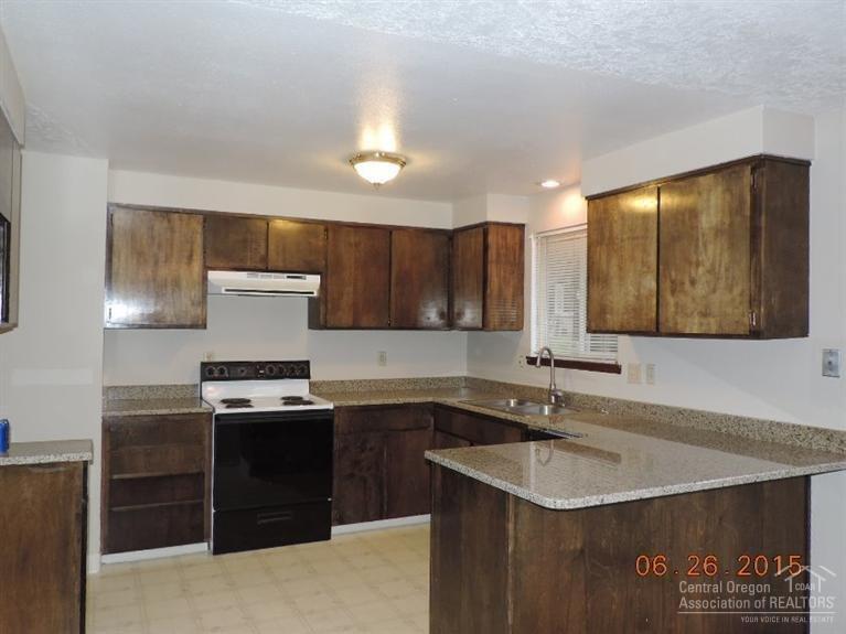 15980 Green Forest Road La Pine, OR 97739 - Photo 9 of 23 Kitchen is open to dining/family rooms.