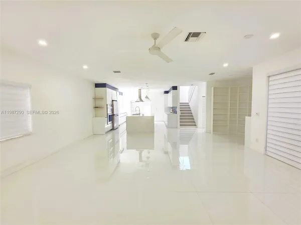 a bathroom with a tub shower and sink