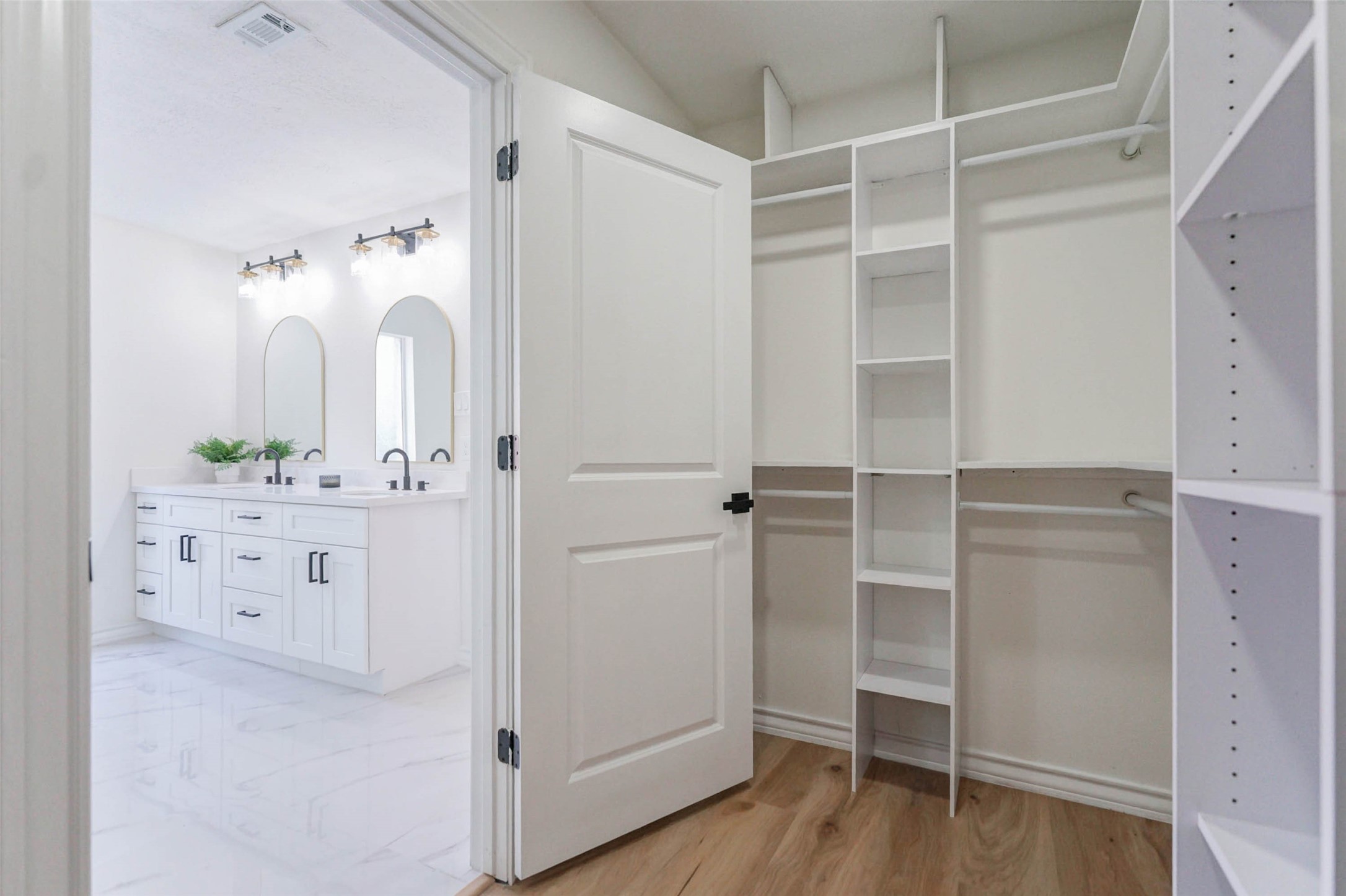 11618 Lakeside Pl Drive Houston, TX 77077 - Photo 16 of 25 a bathroom with a double vanity sink and mirror