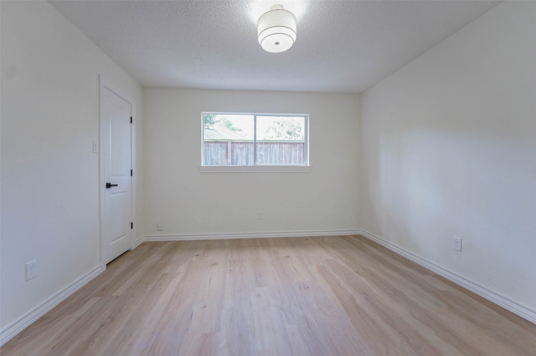 11618 Lakeside Pl Drive Houston, TX 77077 - Photo 19 of 25 wooden floor in an empty room with a window
