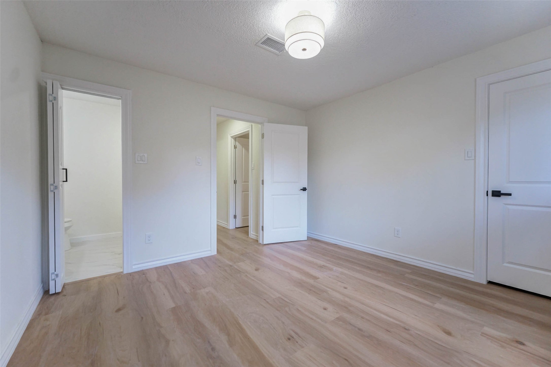 11618 Lakeside Pl Drive Houston, TX 77077 - Photo 20 of 25 a view of an empty room with wooden floor