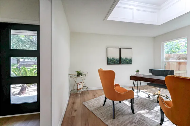 a view of a livingroom with furniture and windows