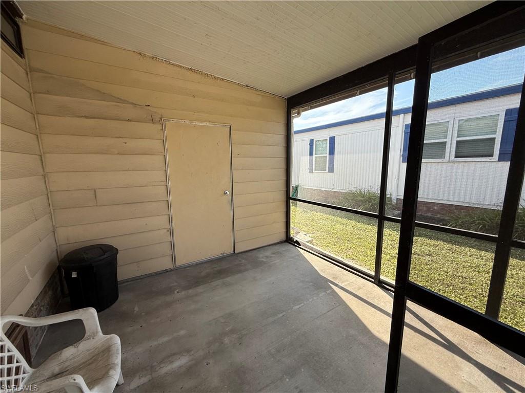 76 Atlantic Way, Unit 76 Naples, FL 34104 - Photo 13 of 18 View of unfurnished sunroom