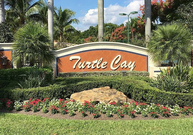 a sign that is in front of flowers