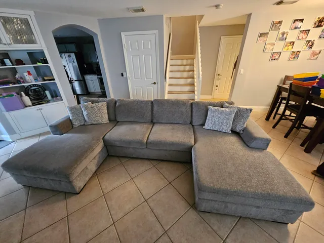 a living room with furniture and a couch