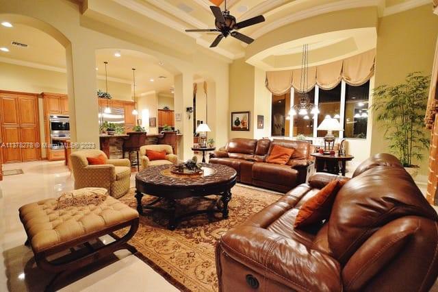 19349 Waters Edge Street Weston, FL 33332 - Photo 14 of 63 a living room with furniture and a large window