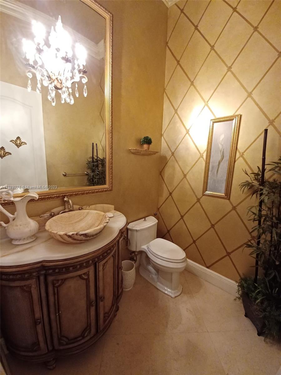 19349 Waters Edge Street Weston, FL 33332 - Photo 15 of 63 a bathroom with a sink a toilet and a shower