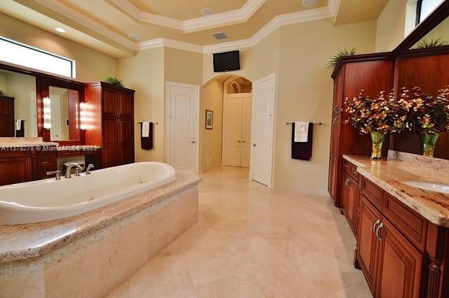 19349 Waters Edge Street Weston, FL 33332 - Photo 19 of 63 a spacious bathroom with a tub sink and mirror