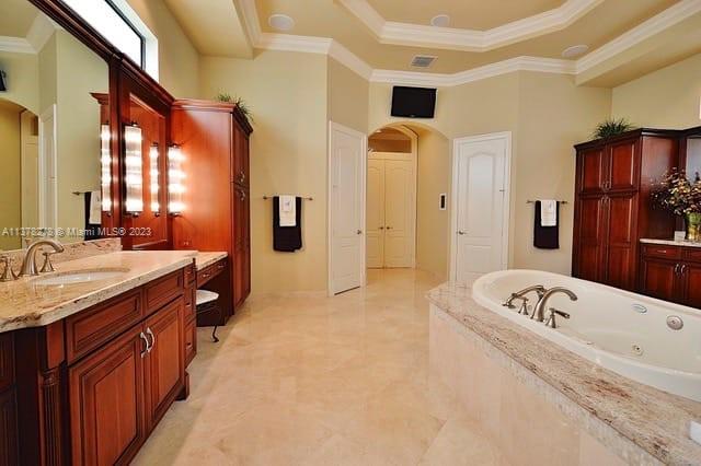 19349 Waters Edge Street Weston, FL 33332 - Photo 20 of 63 a bathroom with a tub sink and mirror
