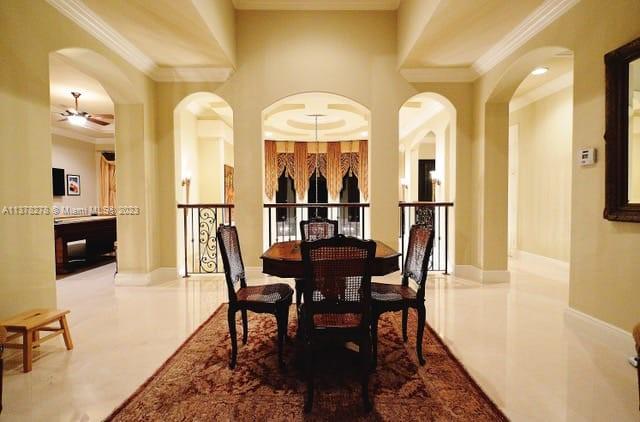 19349 Waters Edge Street Weston, FL 33332 - Photo 29 of 63 a view of a dining room with furniture and a chandelier