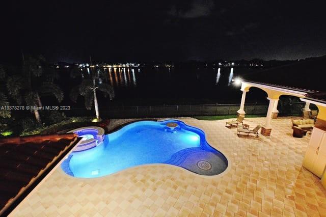 19349 Waters Edge Street Weston, FL 33332 - Photo 49 of 63 a bathroom with a sink and a mirror