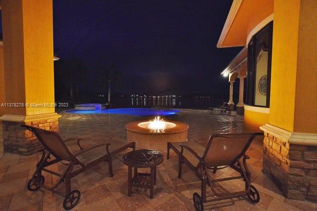 19349 Waters Edge Street Weston, FL 33332 - Photo 51 of 63 a view of a chairs and table in the patio