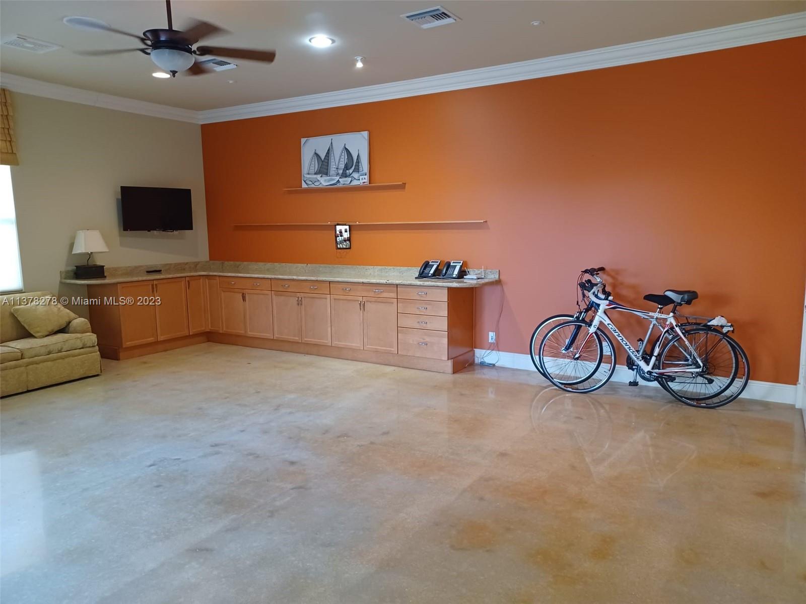 19349 Waters Edge Street Weston, FL 33332 - Photo 54 of 63 a view of a room with gym equipment