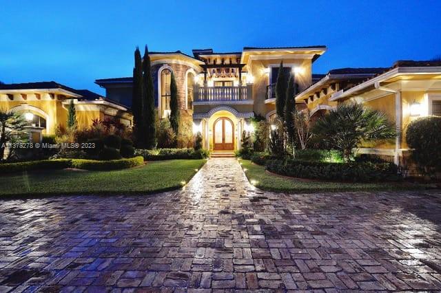 19349 Waters Edge Street Weston, FL 33332 - Photo 59 of 63 a front view of a house with garden