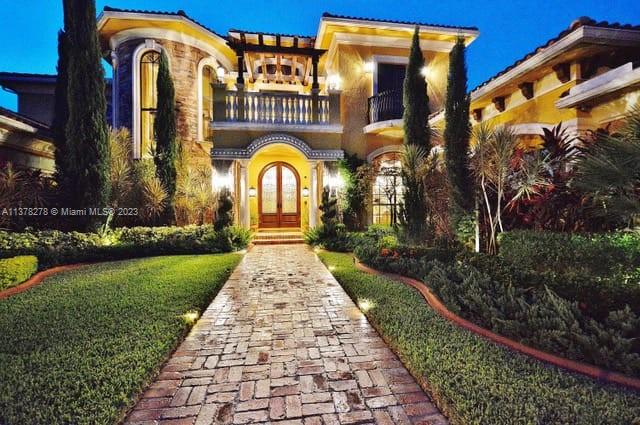 19349 Waters Edge Street Weston, FL 33332 - Photo 60 of 63 a front view of a house with garden