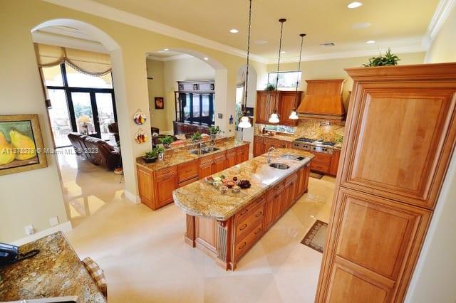 19349 Waters Edge Street Weston, FL 33332 - Photo 6 of 63 a large white kitchen with a large window