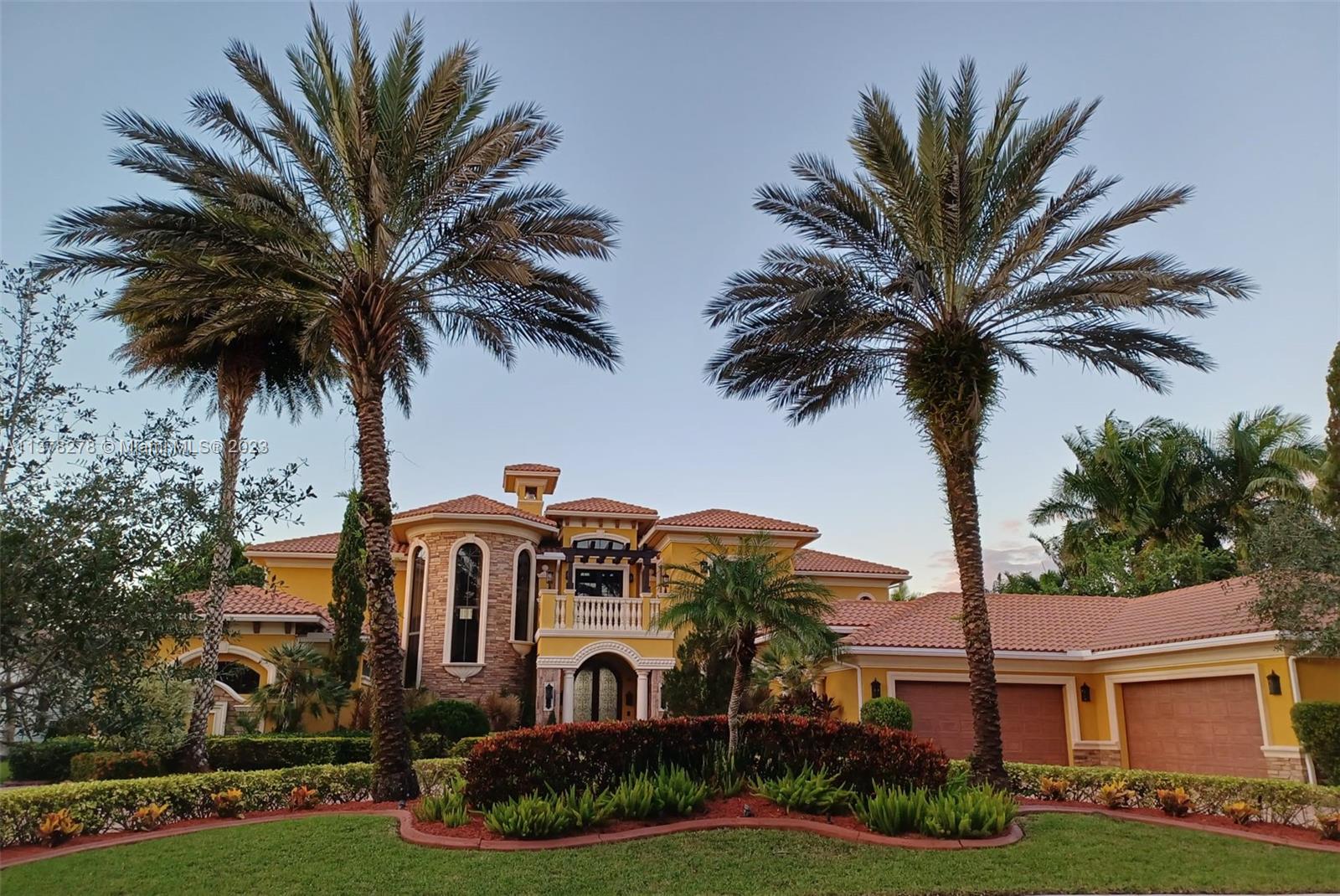 19349 Waters Edge Street Weston, FL 33332 - Photo 62 of 63 front view of house with a palm tree