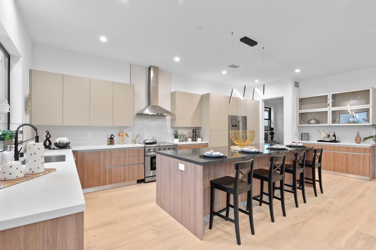 719 East Homestead Road Sunnyvale, CA 94087 - Photo 13 of 47 a kitchen with stainless steel appliances kitchen island granite countertop a sink and cabinets