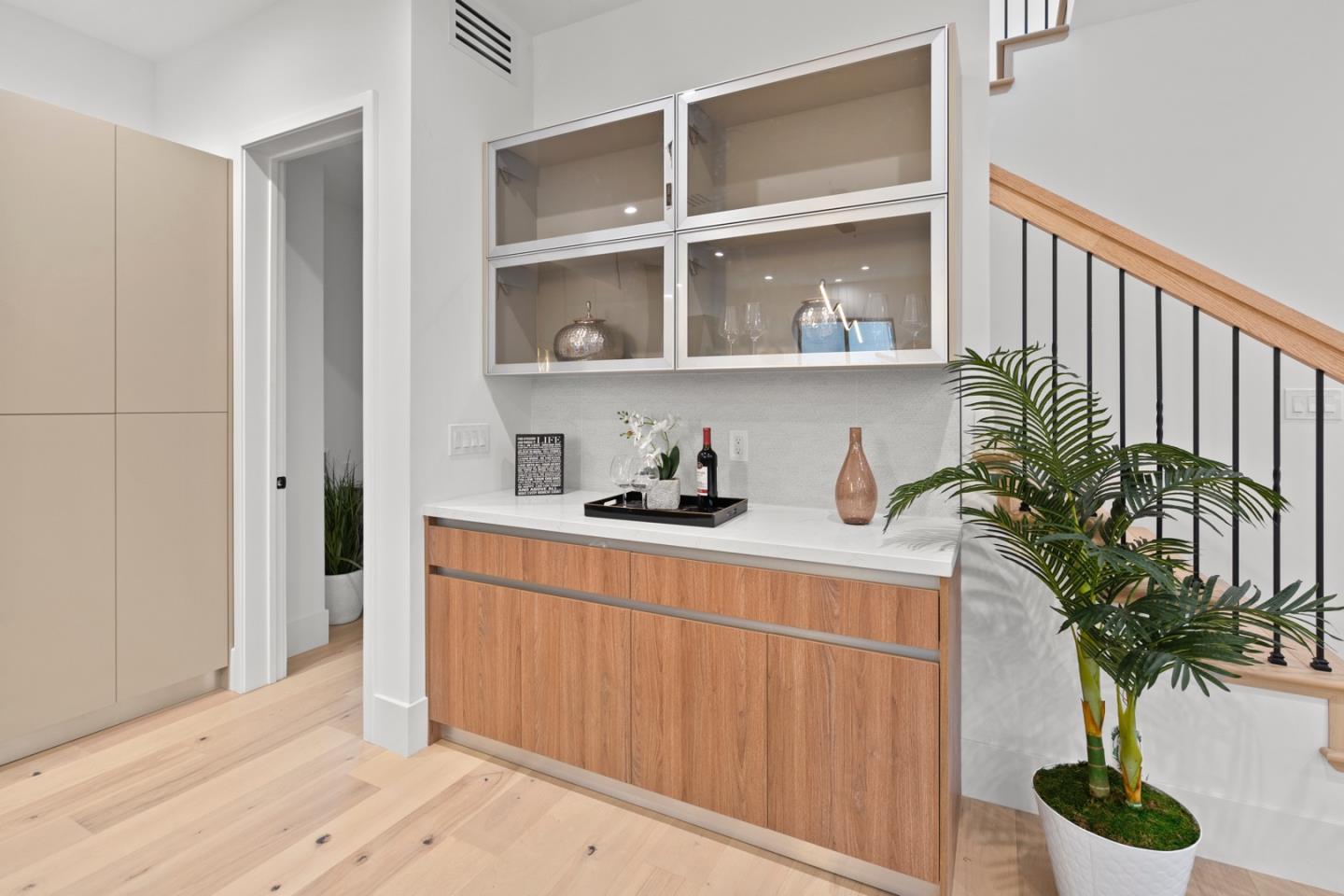719 East Homestead Road Sunnyvale, CA 94087 - Photo 16 of 47 a kitchen with a potted plant on the counter and a wooden floor