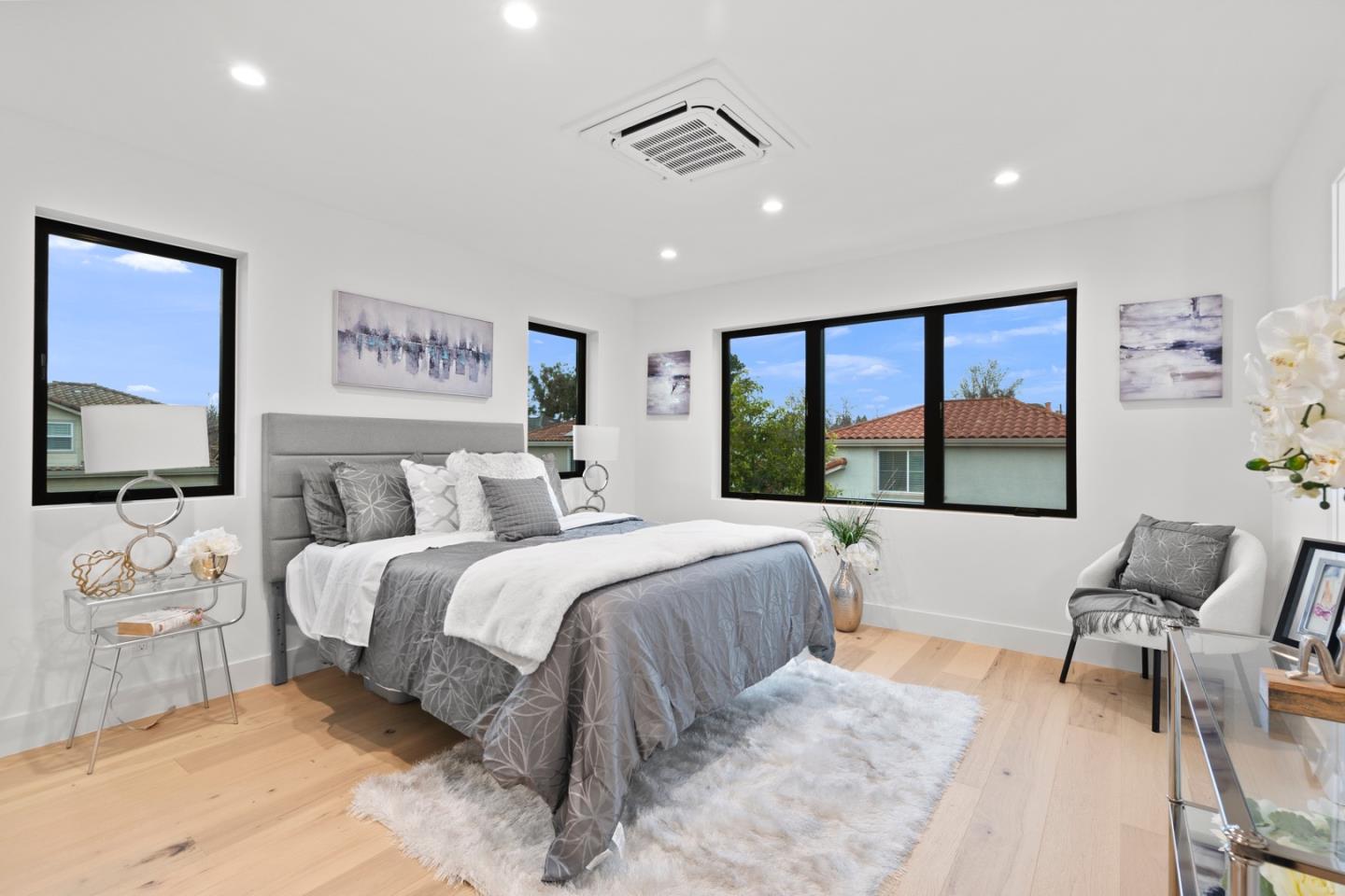 719 East Homestead Road Sunnyvale, CA 94087 - Photo 22 of 47 a bedroom with a large bed and a large window