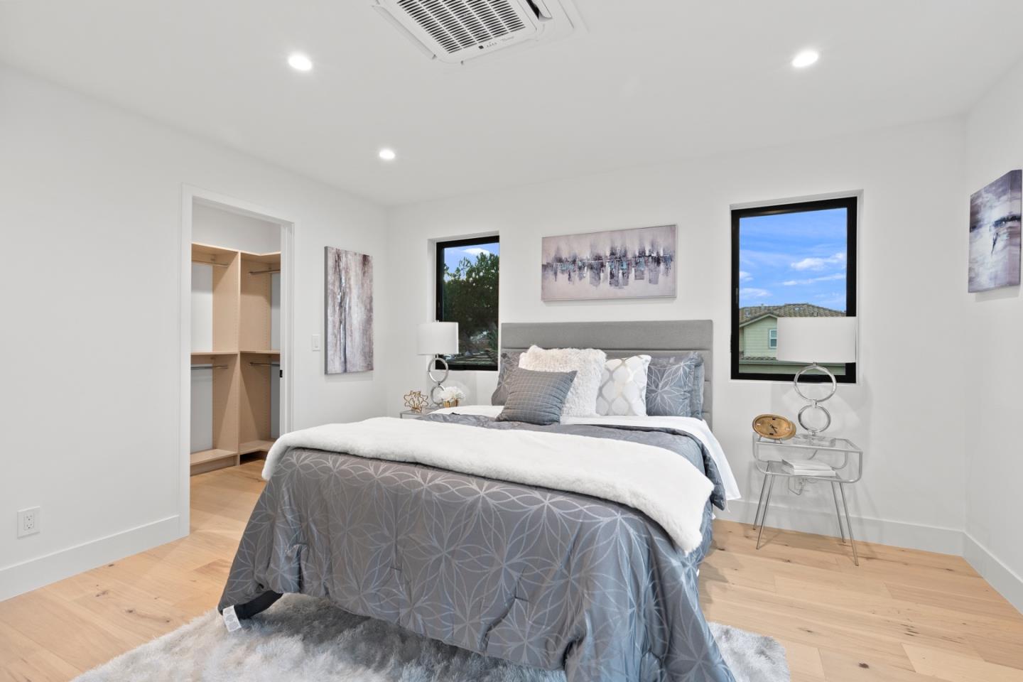 719 East Homestead Road Sunnyvale, CA 94087 - Photo 23 of 47 a spacious bedroom with a bed and a cabinets