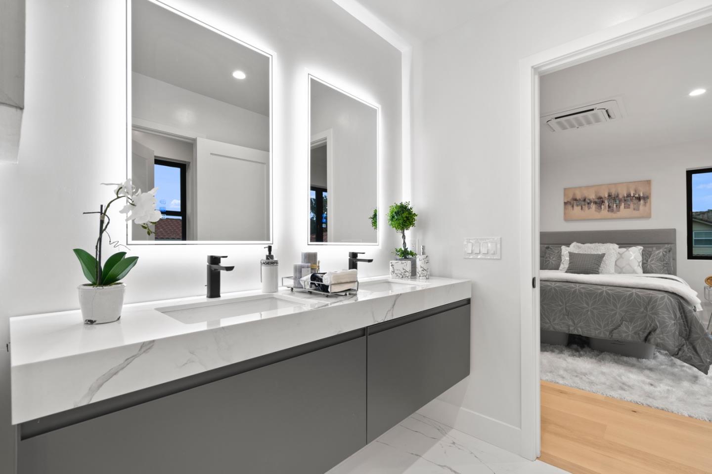 719 East Homestead Road Sunnyvale, CA 94087 - Photo 26 of 47 a bathroom with a granite countertop sink and a mirror