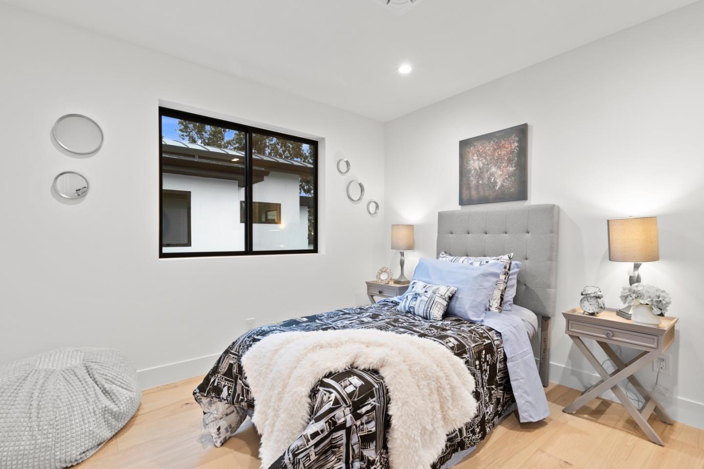 719 East Homestead Road Sunnyvale, CA 94087 - Photo 35 of 47 a bedroom with a bed and a lamp