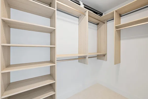 a view of an empty walk in closet