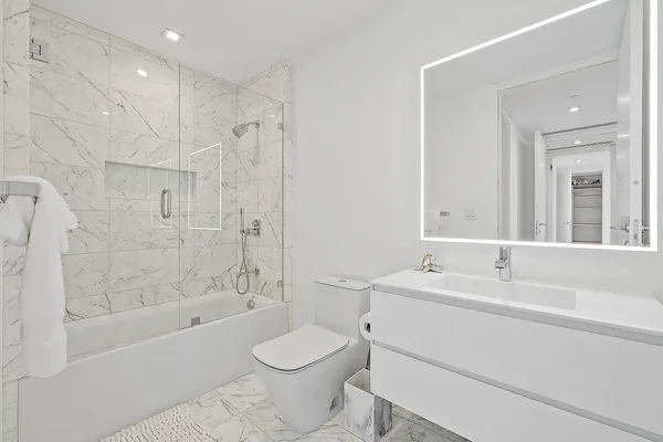 a bathroom with a sink toilet a shower and bathtub