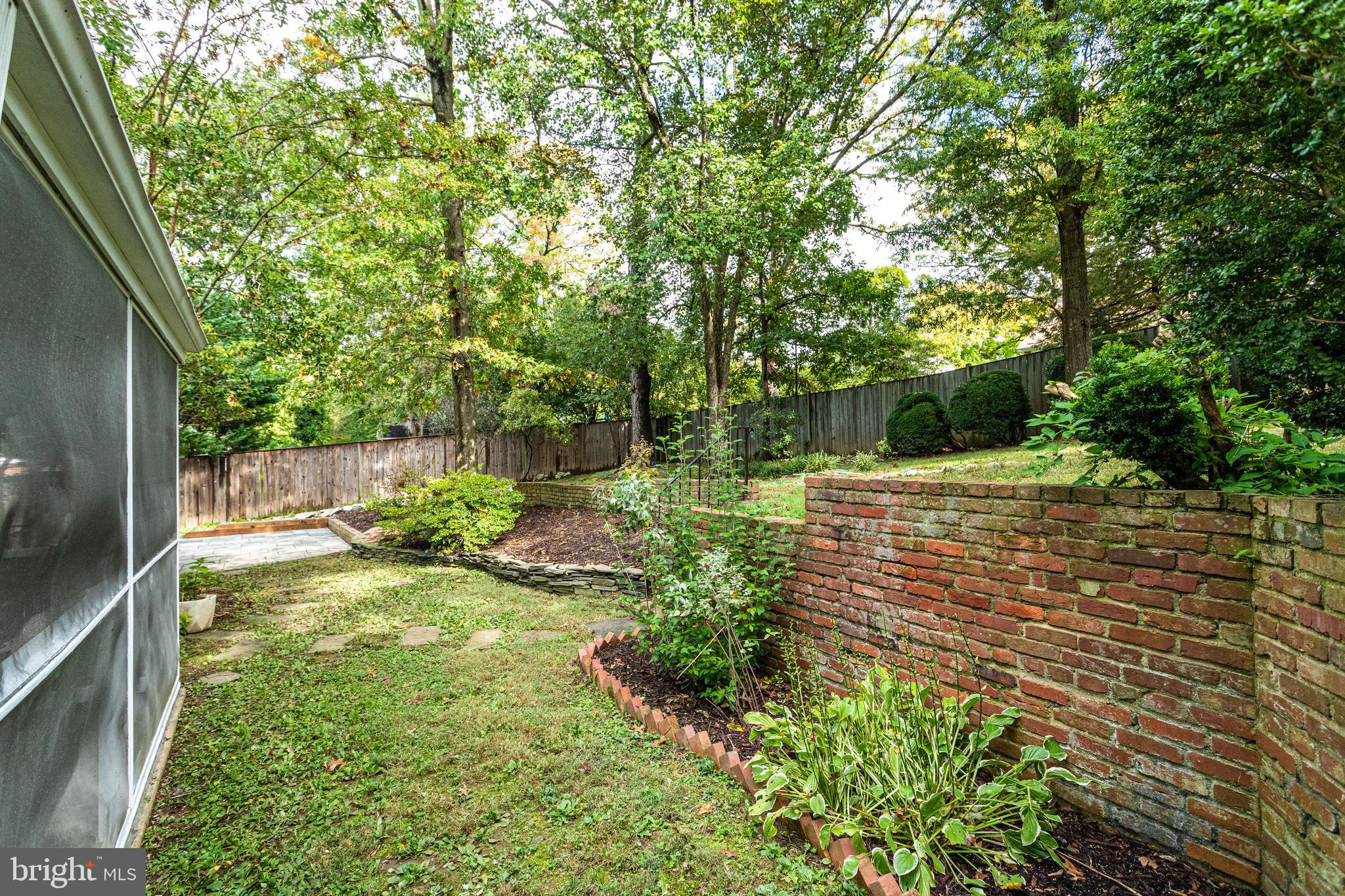 7107 Fort Hunt Road Alexandria, VA 22307 - Photo 58 of 62 Brick retaining wall in backyard