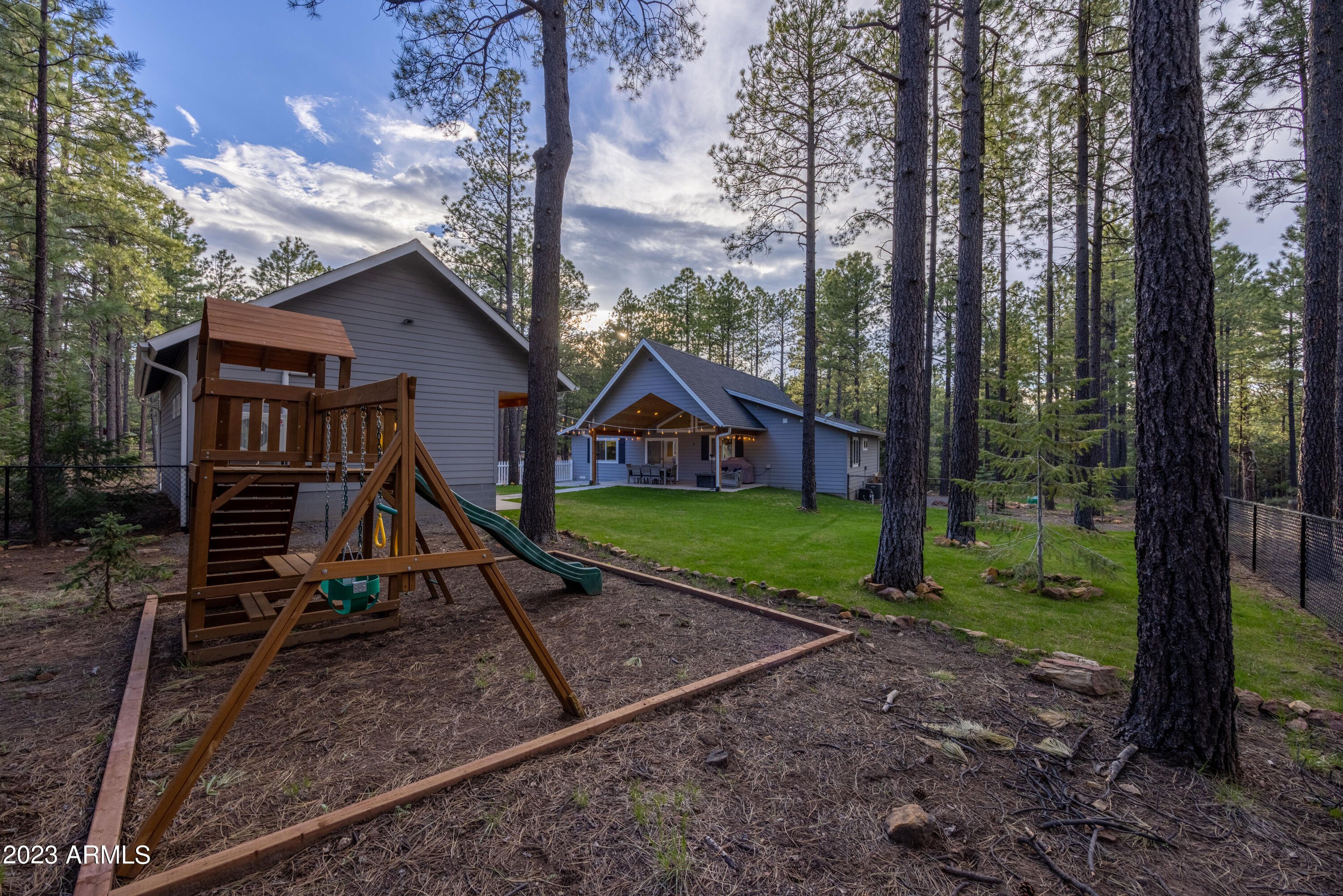 2772 Larson Loop Forest Lakes, AZ 85931 - Photo 43 of 65 a view of a house with backyard and wooden fence