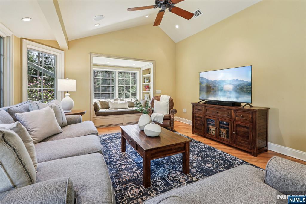 132 Dimmig Road Upper Saddle River, NJ 07458 - Photo 13 of 33 a living room with furniture and a flat screen tv