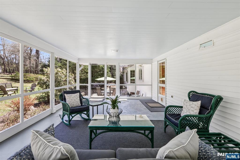 132 Dimmig Road Upper Saddle River, NJ 07458 - Photo 16 of 33 a living room with furniture and a large window