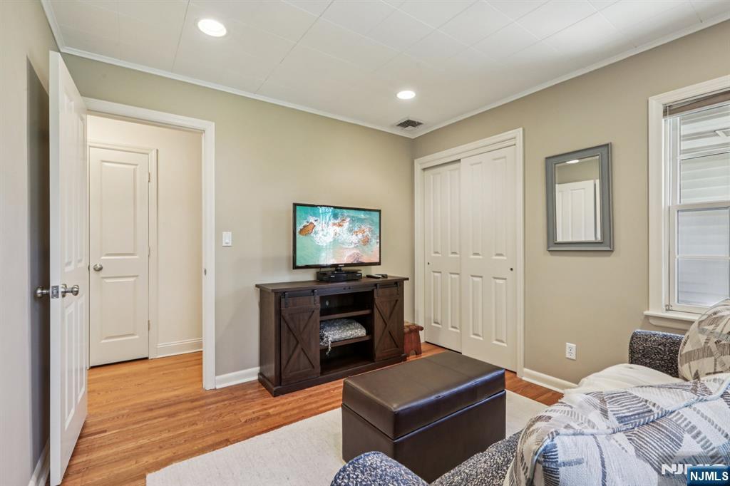 132 Dimmig Road Upper Saddle River, NJ 07458 - Photo 21 of 33 a bedroom with furniture and a fireplace