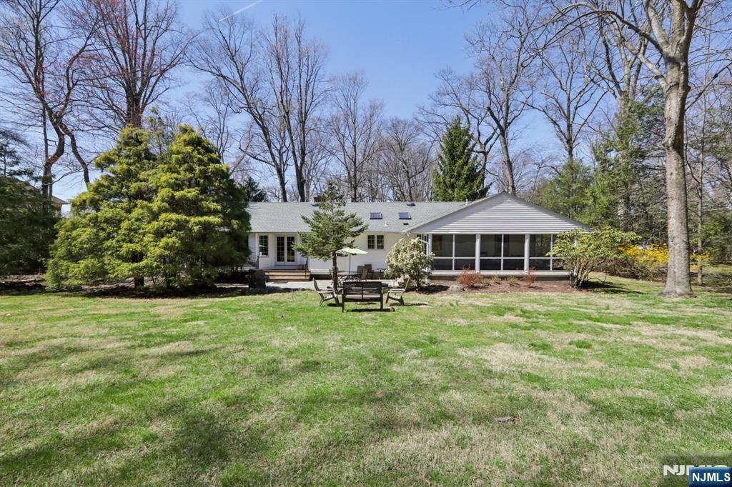 132 Dimmig Road Upper Saddle River, NJ 07458 - Photo 29 of 33 a front view of a house with garden