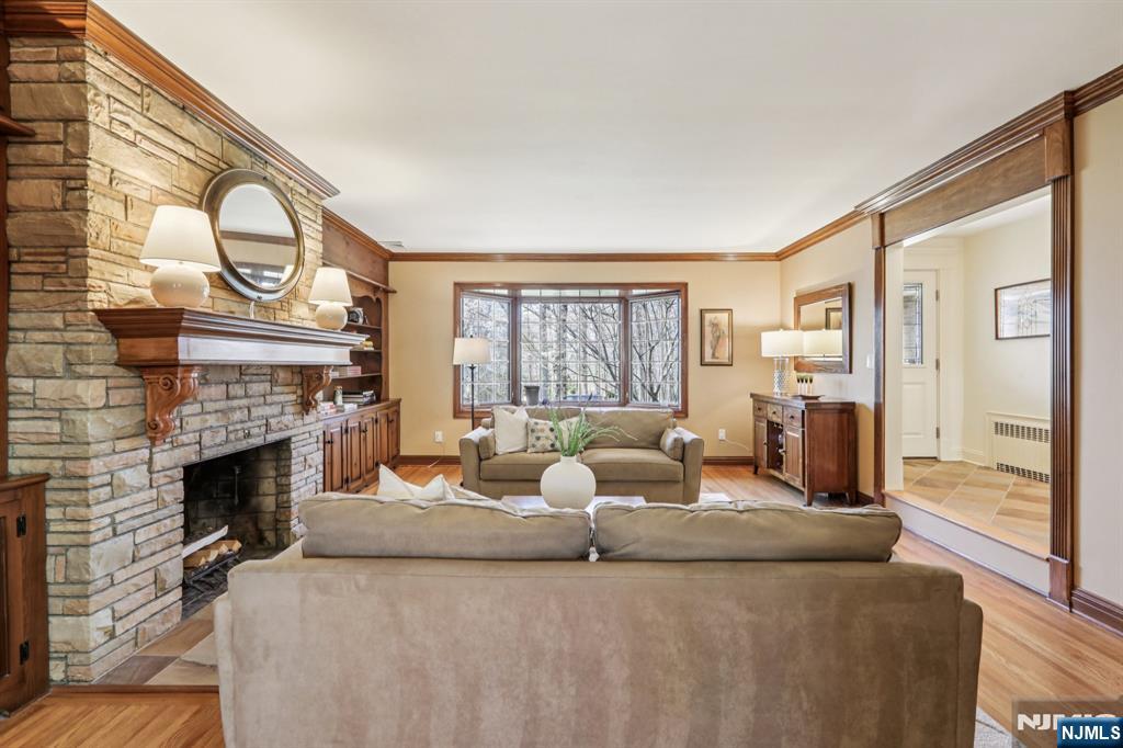 132 Dimmig Road Upper Saddle River, NJ 07458 - Photo 6 of 33 a living room with furniture a fireplace and a large window