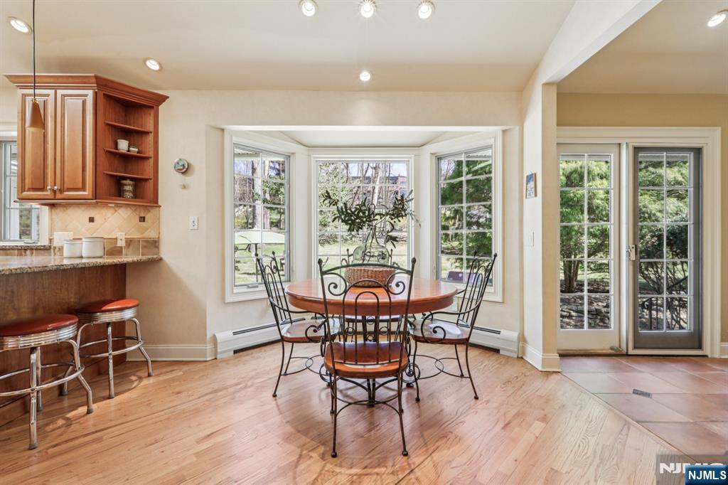 132 Dimmig Road Upper Saddle River, NJ 07458 - Photo 10 of 33 a view of a dining room with furniture and wooden floor