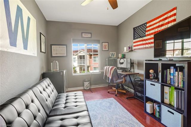 a bedroom with furniture and a book shelf