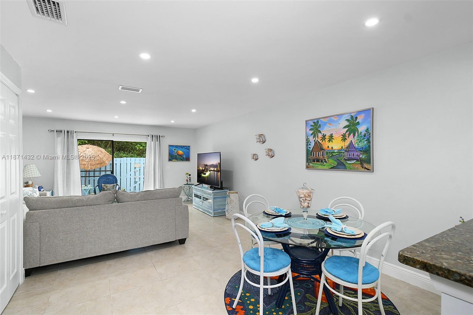 9421 South Ocean Drive, Unit 90 Jensen Beach, FL 34957 - Photo 11 of 49 a living room with furniture and a large window