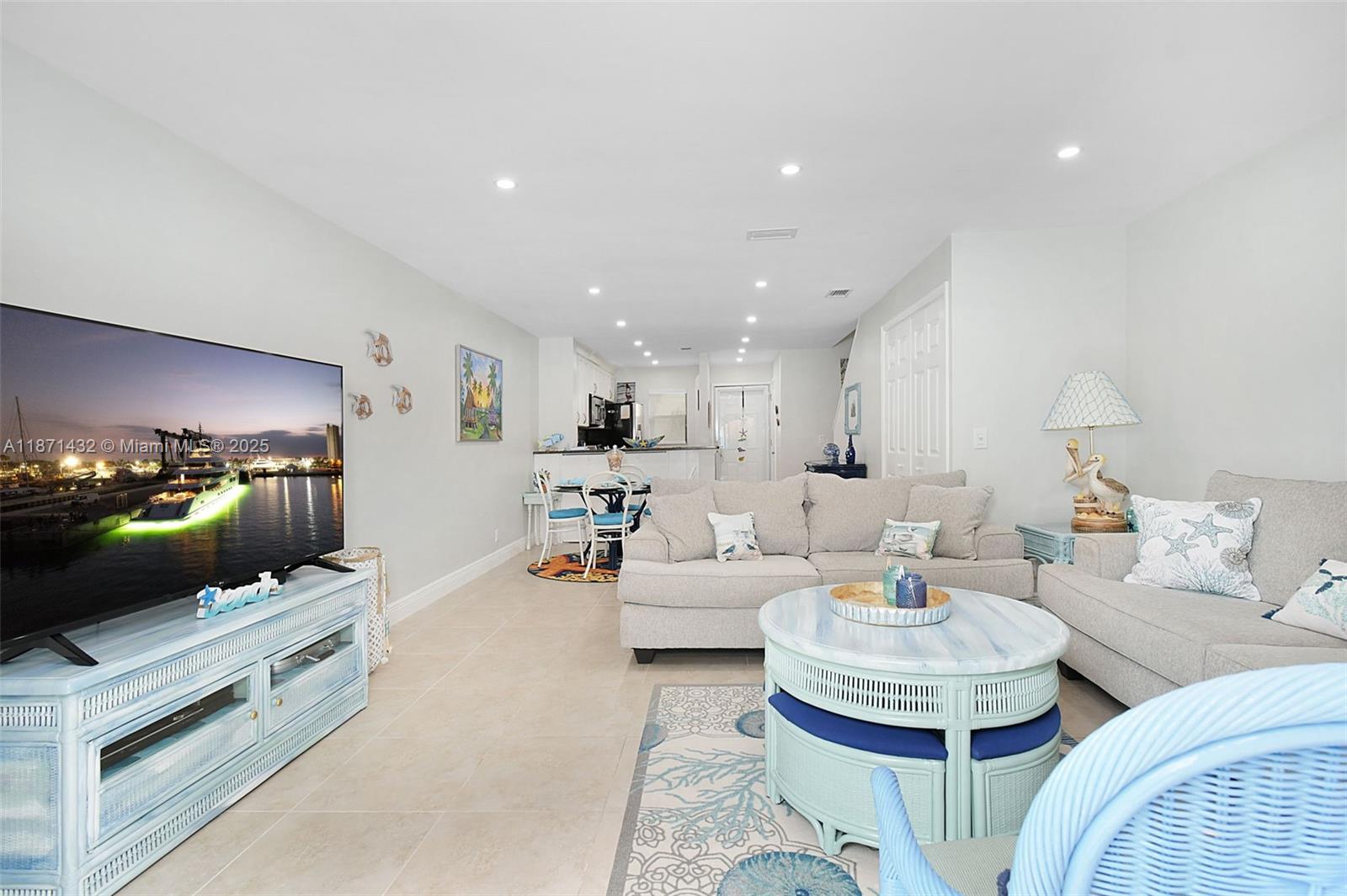 9421 South Ocean Drive, Unit 90 Jensen Beach, FL 34957 - Photo 14 of 49 a living room with furniture and a fireplace