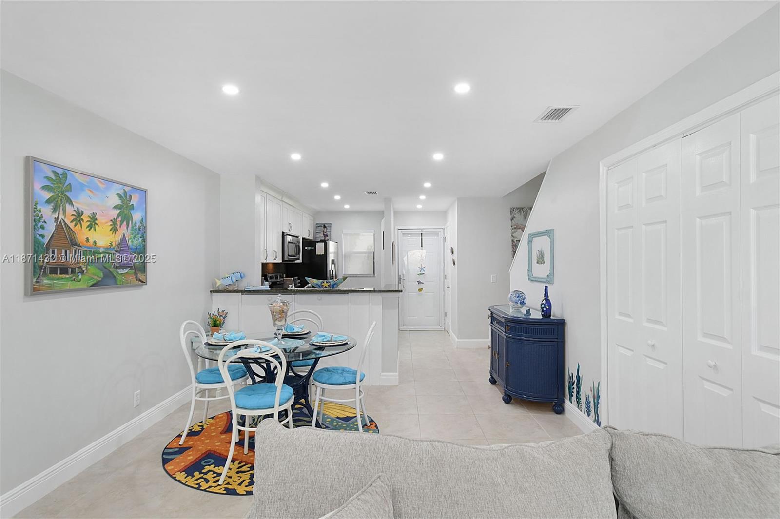 9421 South Ocean Drive, Unit 90 Jensen Beach, FL 34957 - Photo 21 of 49 a living room with furniture and kitchen view