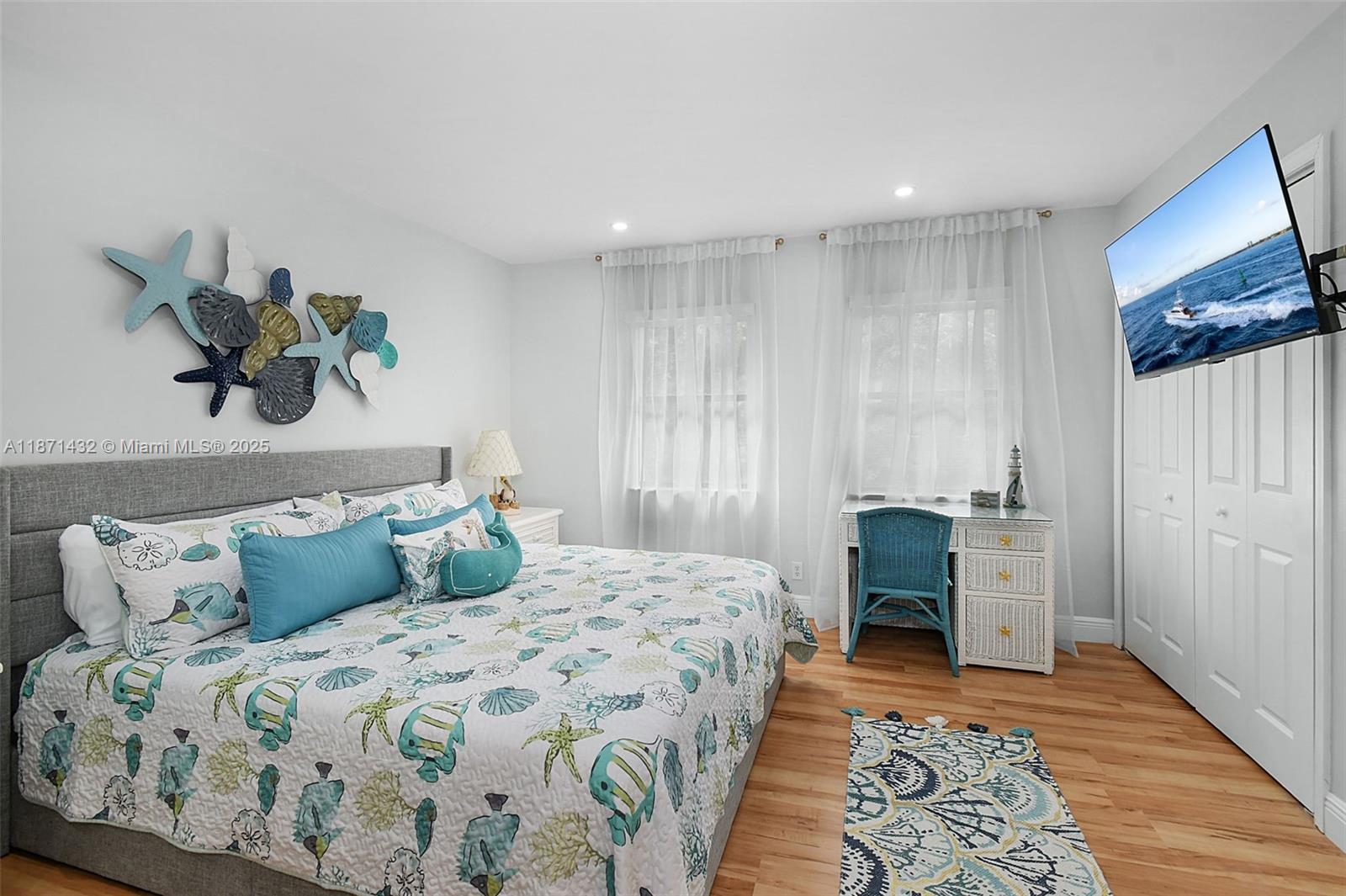 9421 South Ocean Drive, Unit 90 Jensen Beach, FL 34957 - Photo 22 of 49 a bedroom with a bed and a painting on the wall