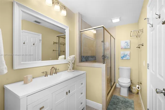 a bathroom with a sink vanity and a mirror