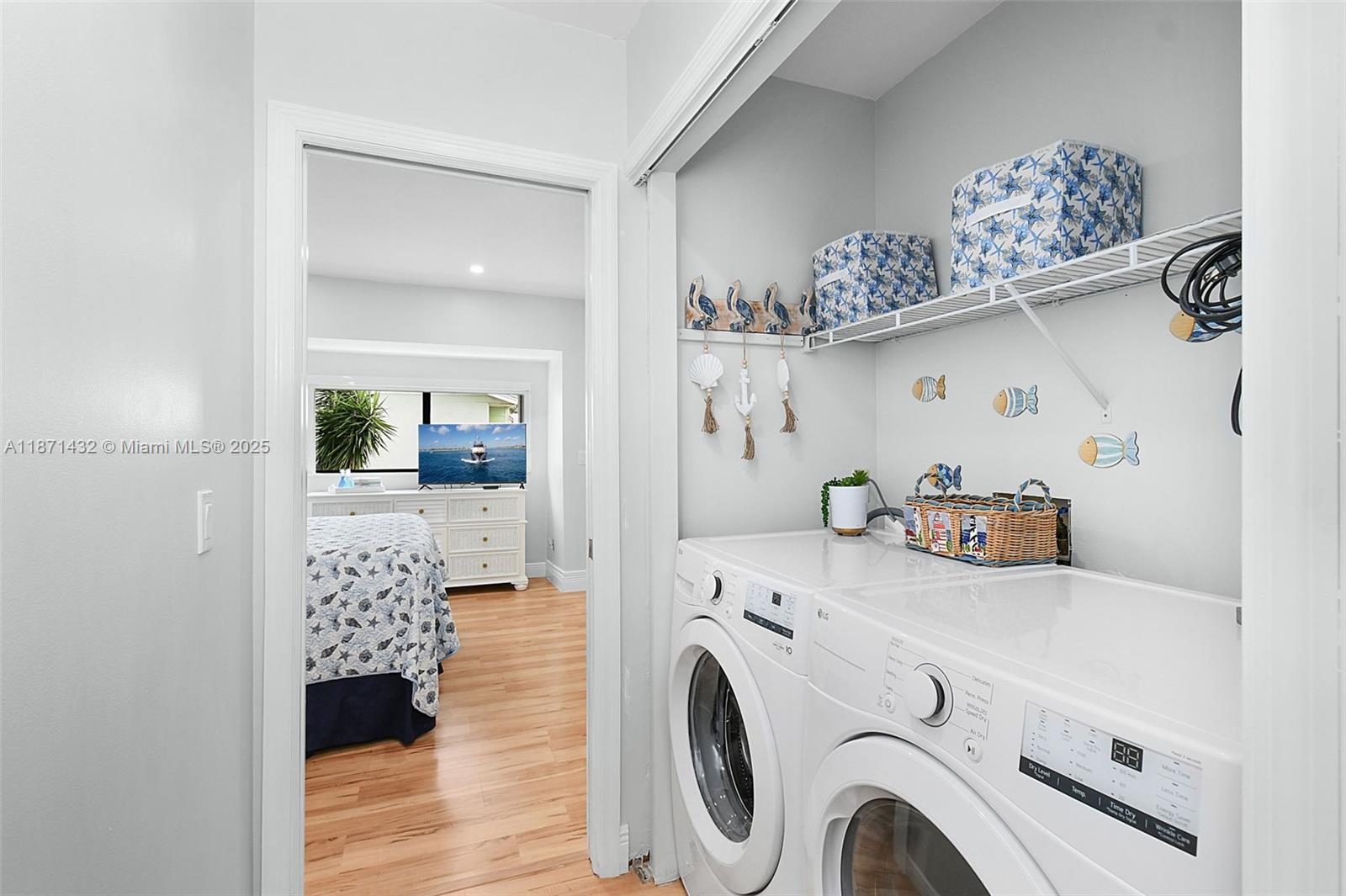 9421 South Ocean Drive, Unit 90 Jensen Beach, FL 34957 - Photo 28 of 49 a view of washer and dryer with kitchen in the background