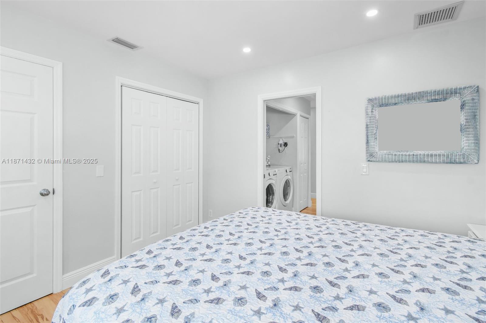 9421 South Ocean Drive, Unit 90 Jensen Beach, FL 34957 - Photo 32 of 49 a bedroom with a bed and a window